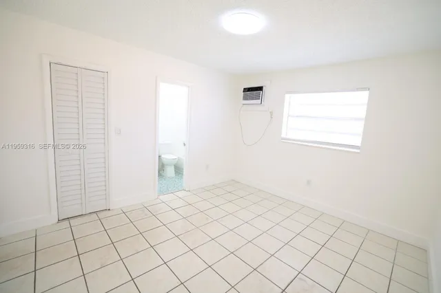 a view of an empty room and window