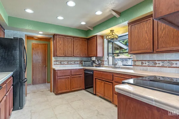 a kitchen with a sink and a window