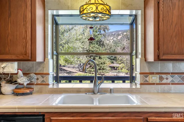 a kitchen with a sink and a window