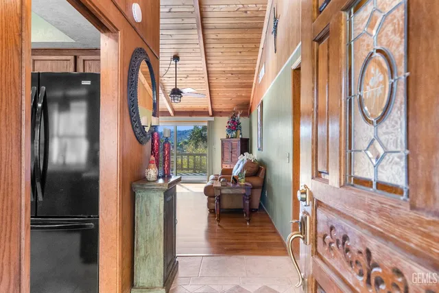 a very nice looking room with a large window and a chandelier