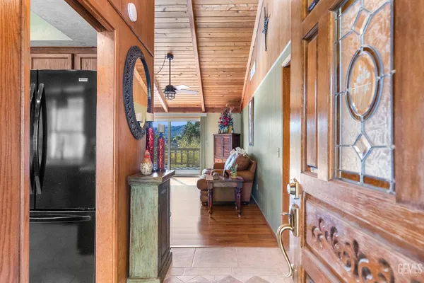 a view of a balcony with wooden floor and outdoor seating