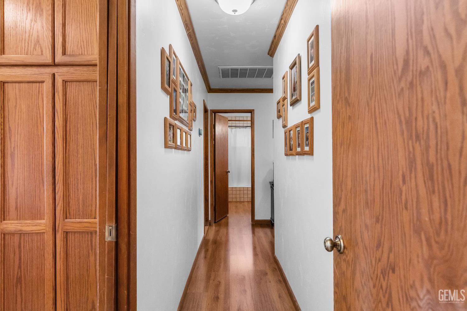Undisclosed Address Tehachapi, CA 93561 - Photo 26 of 58 a view of a hallway with wooden floor and staircase