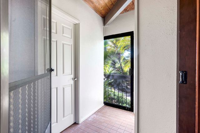a view of a front door and wooden floor