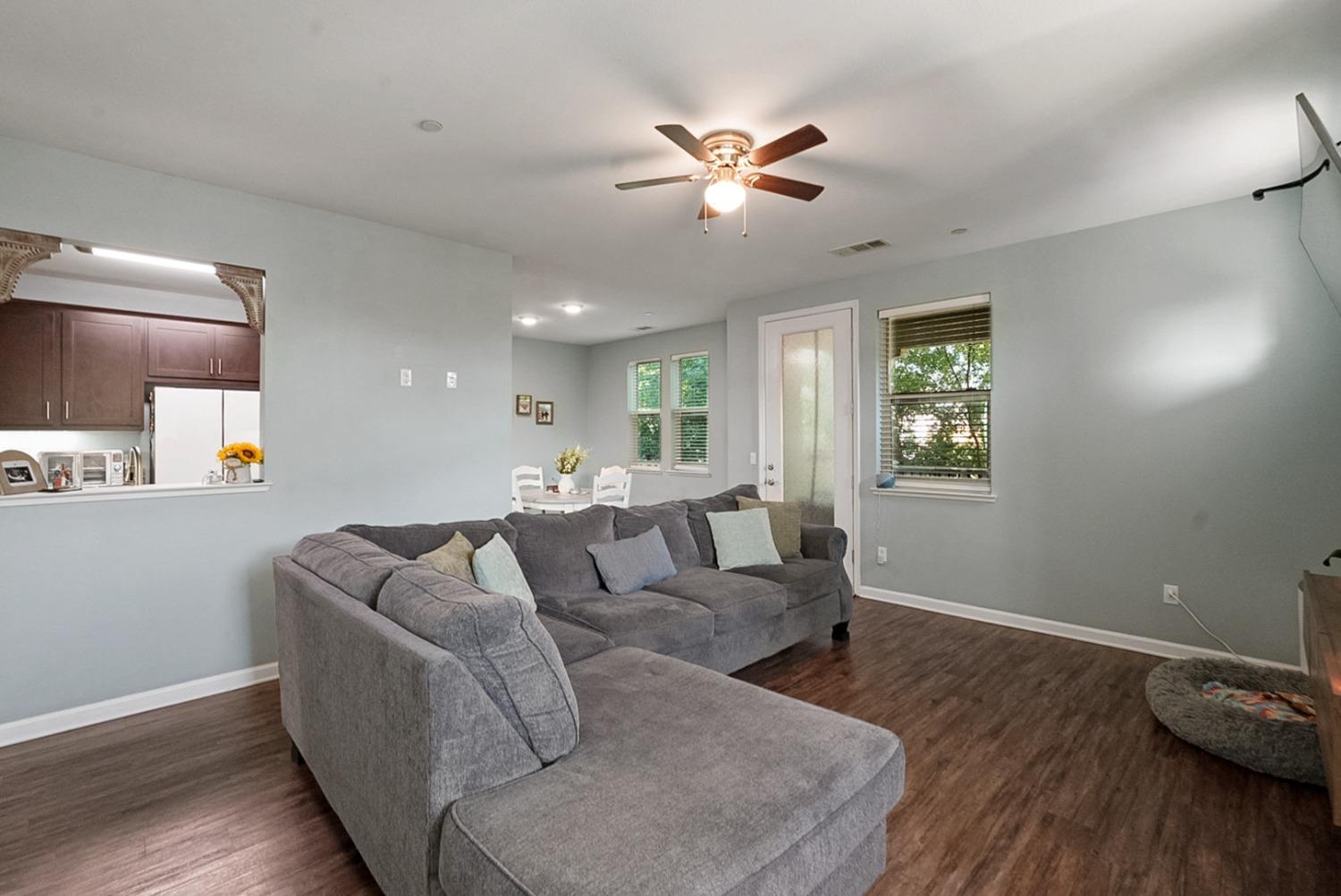 140 Ivy Avenue, Unit A5 Patterson, CA 95363 - Photo 6 of 26 a living room with furniture and a wooden floor