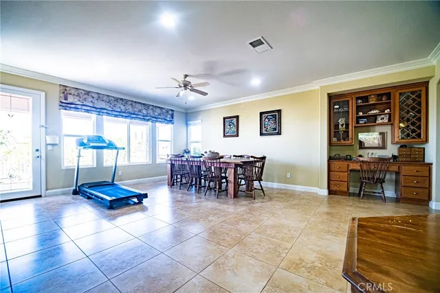 a living room with furniture and large window