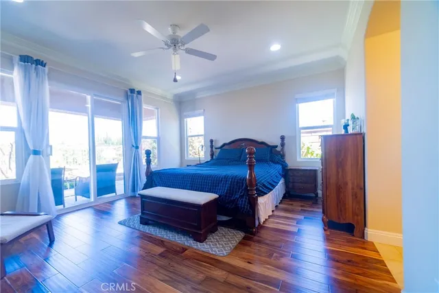 a large kitchen with kitchen island a sink a stove a chimney a dining table and chairs