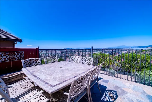 a view of a balcony with furniture