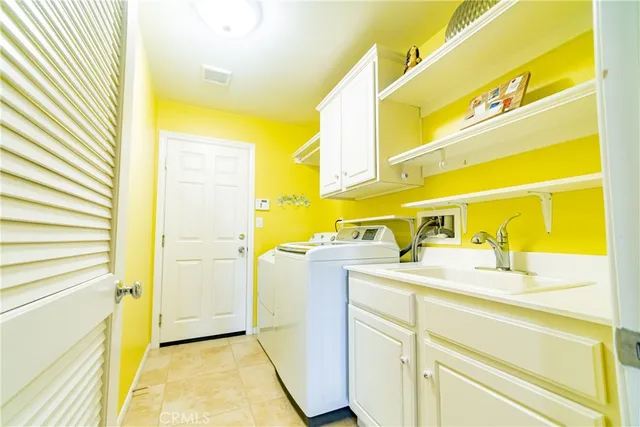 a view of staircase with furniture and a chandelier