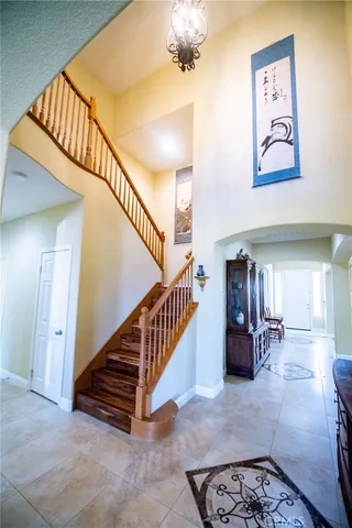 a room with furniture a rug and a window