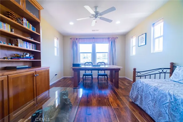 a bedroom with a bed and a dresser