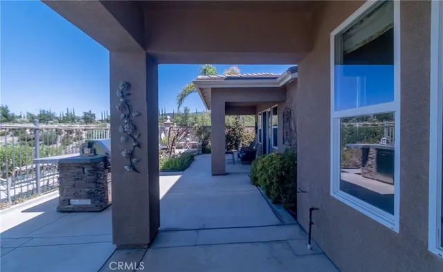 a view of a house with a yard and sitting area