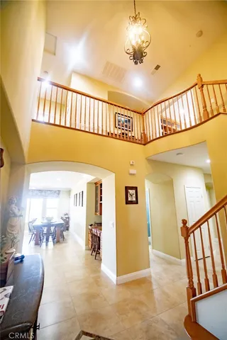a view of a livingroom with furniture and staircase