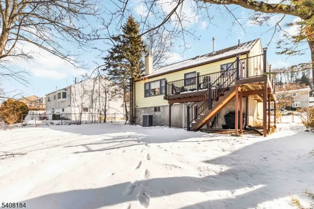 a view of a house with snow on the road