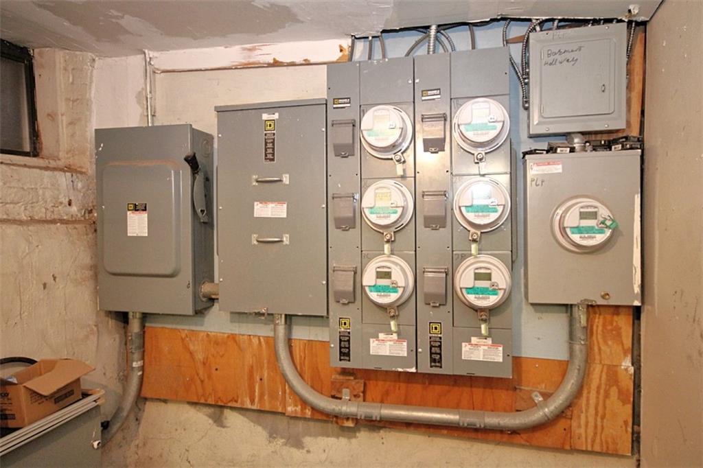 6018 4th Avenue Brooklyn, NY 11220 - Photo 14 of 15 a bathroom with a sink and a mirror