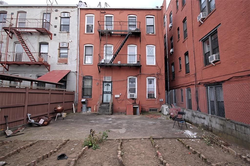 6018 4th Avenue Brooklyn, NY 11220 - Photo 2 of 15 a view of a brick building with many windows