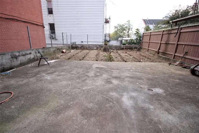 a backyard of a house with shaded area