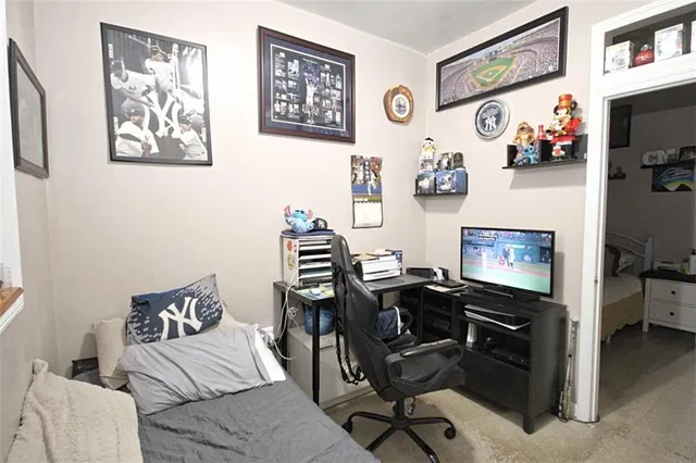 a view of a workspace with furniture and workspace