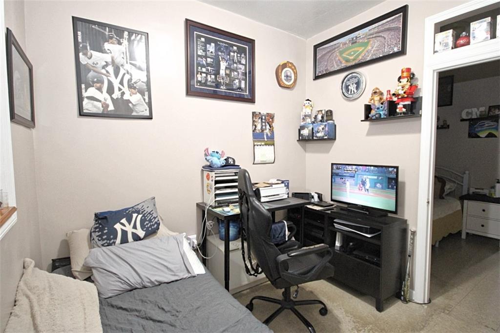 6018 4th Avenue Brooklyn, NY 11220 - Photo 9 of 15 a view of a workspace with furniture and workspace