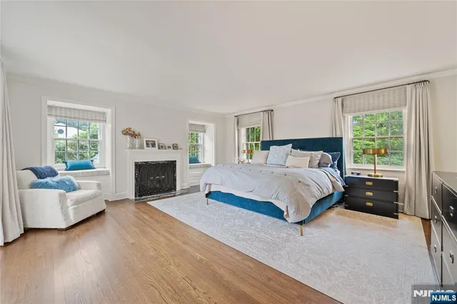 a bedroom with a balcony a bed and a couch