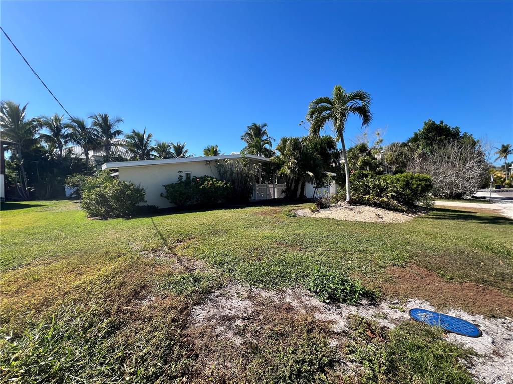 717 Jacaranda Road Anna Maria, FL 34216 - Photo 4 of 9 a view of a garden