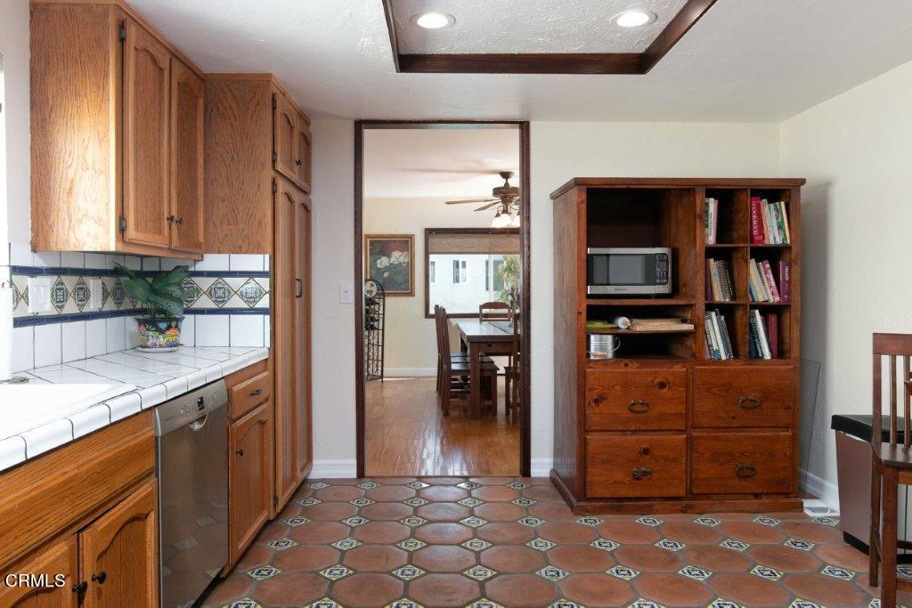 5000 Dolphin Way Oxnard, CA 93035 - Photo 26 of 56 a kitchen with stainless steel appliances granite countertop a refrigerator and a sink