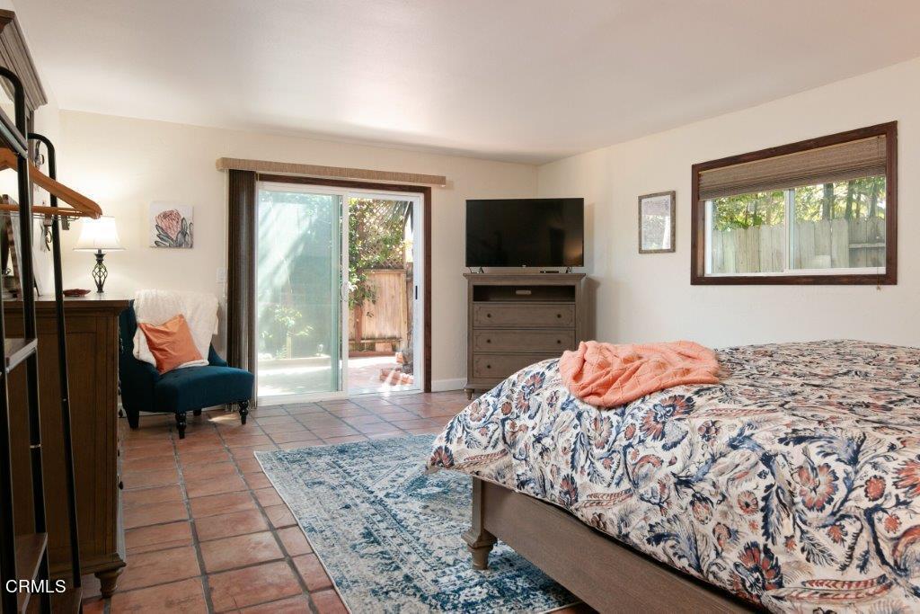 5000 Dolphin Way Oxnard, CA 93035 - Photo 31 of 56 a bedroom with a bed and wooden floor