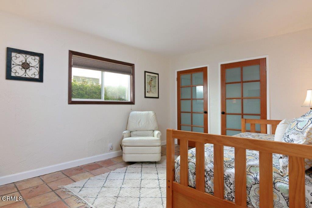 5000 Dolphin Way Oxnard, CA 93035 - Photo 37 of 56 a bedroom with furniture and a window