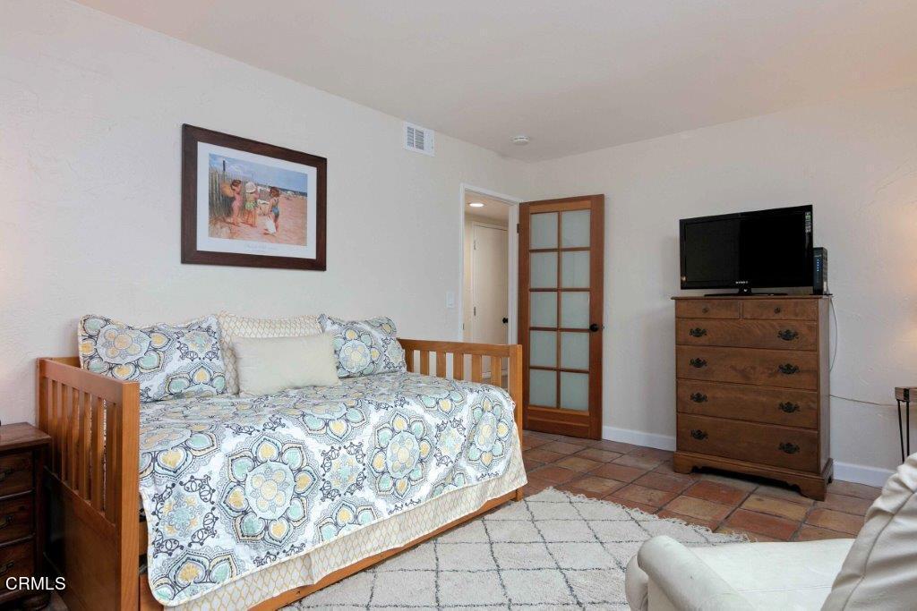 5000 Dolphin Way Oxnard, CA 93035 - Photo 38 of 56 a bedroom with a bed and a television