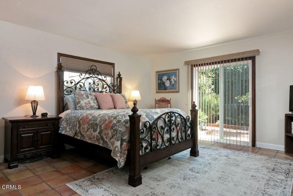 5000 Dolphin Way Oxnard, CA 93035 - Photo 41 of 56 a bedroom with a bed and a lamp next to a window