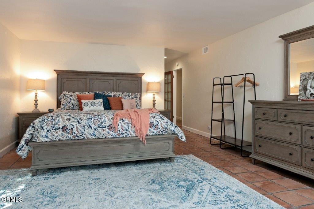 5000 Dolphin Way Oxnard, CA 93035 - Photo 50 of 56 a bed sitting in a bedroom next to a dresser with mirror