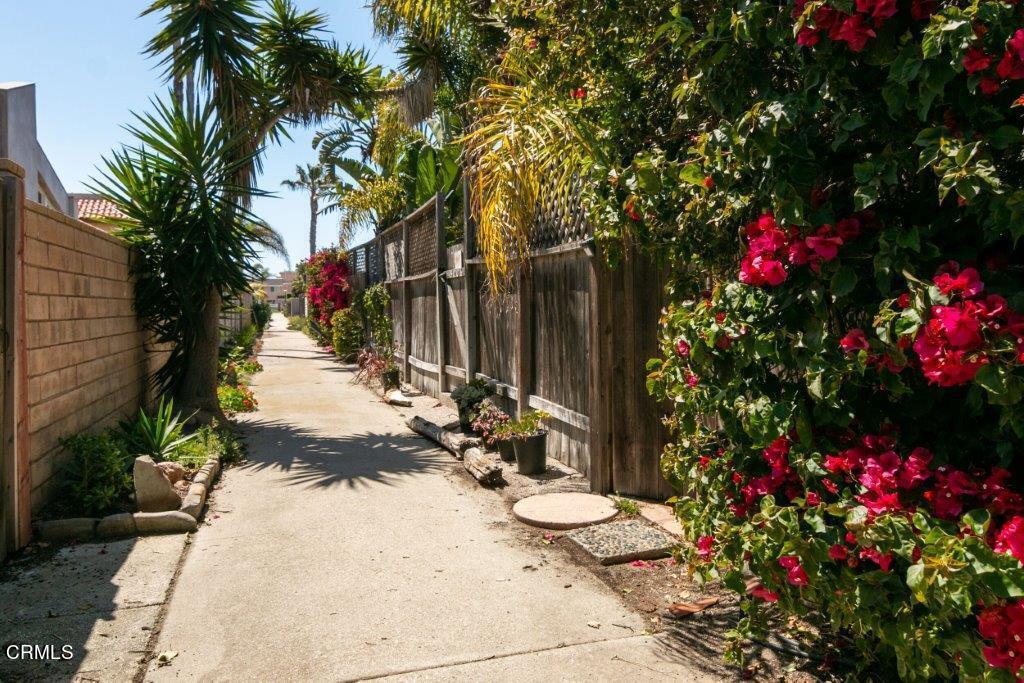 5000 Dolphin Way Oxnard, CA 93035 - Photo 54 of 56 a front view of a house with a yard and fountain