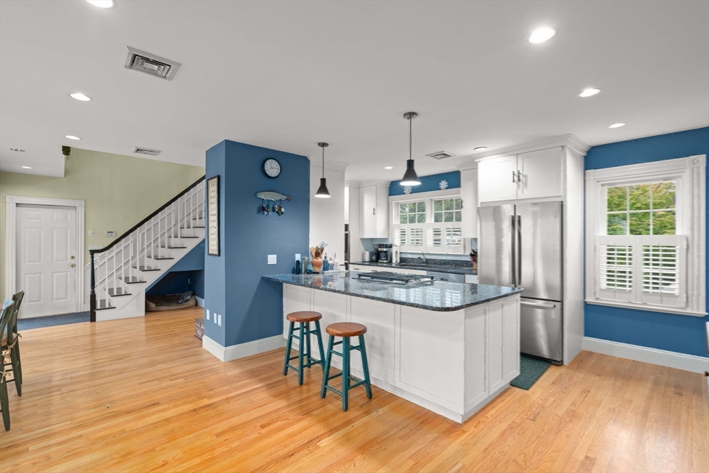 600 East Street Dedham, MA 02026 - Photo 13 of 39 a kitchen with stainless steel appliances granite countertop a refrigerator and a stove top oven