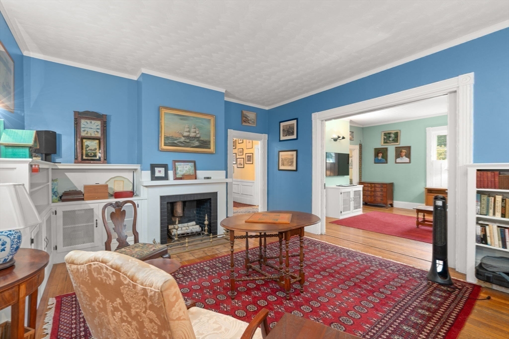 600 East Street Dedham, MA 02026 - Photo 22 of 39 a living room with furniture and a fireplace