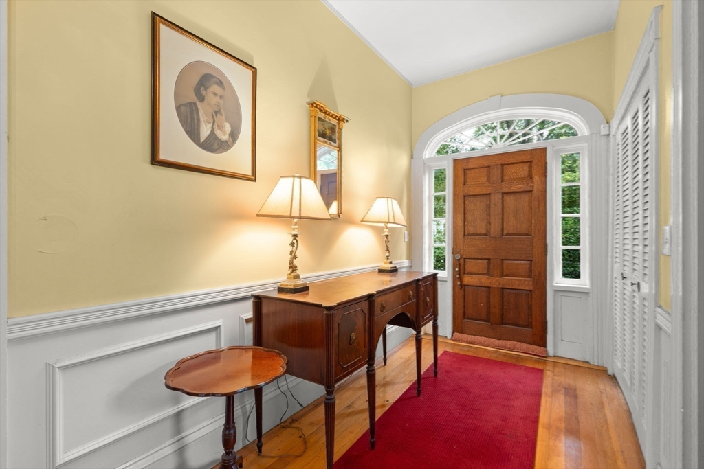 600 East Street Dedham, MA 02026 - Photo 24 of 39 a view of a room that has a table and a chair in it