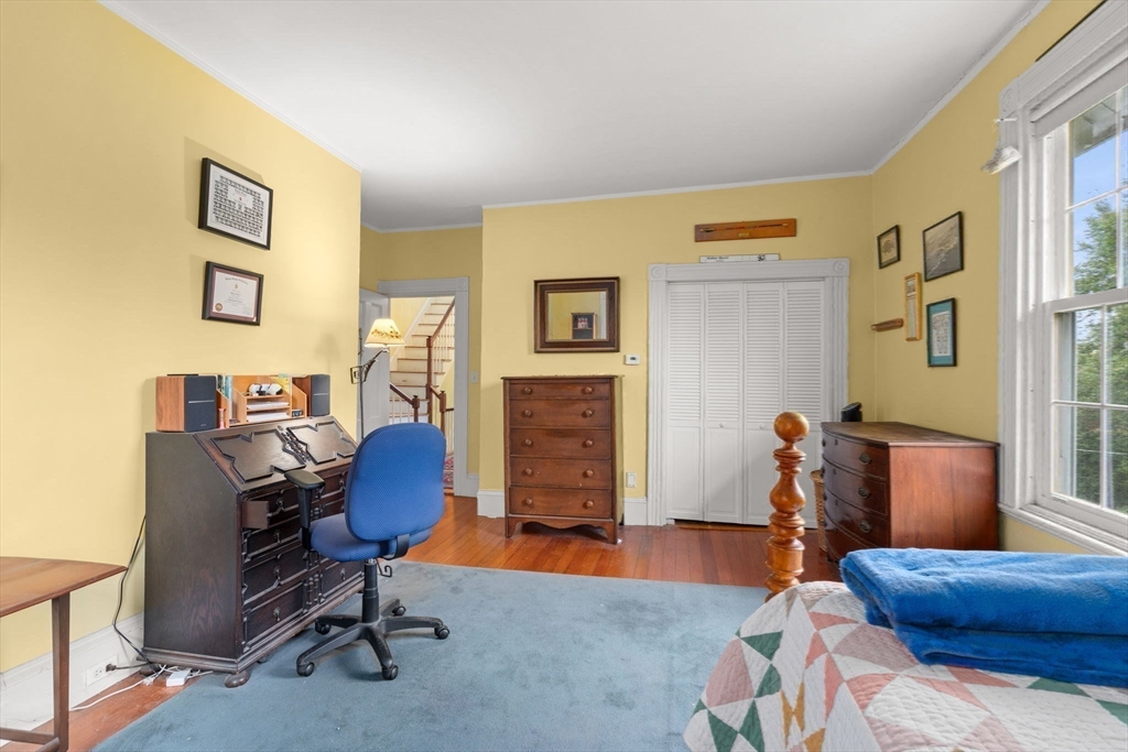 600 East Street Dedham, MA 02026 - Photo 27 of 39 a bedroom with a workspace