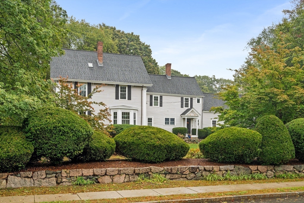 600 East Street Dedham, MA 02026 - Photo 3 of 39 a front view of a house with a garden