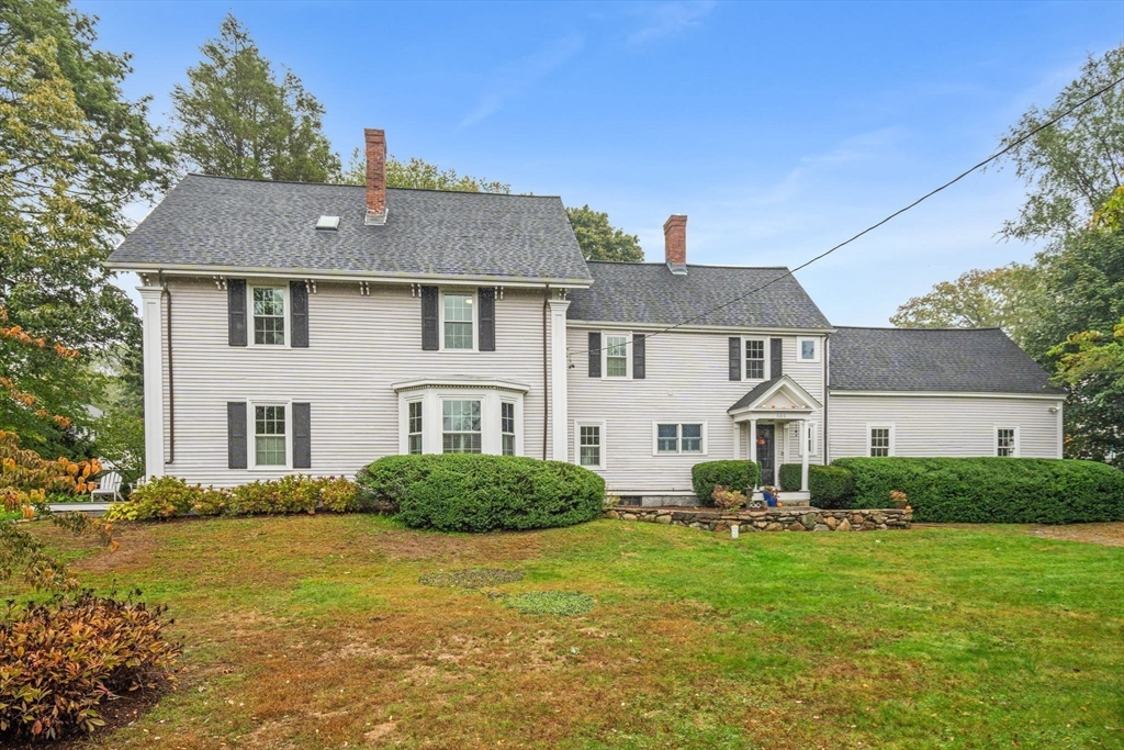 600 East Street Dedham, MA 02026 - Photo 5 of 39 a front view of a house with a garden
