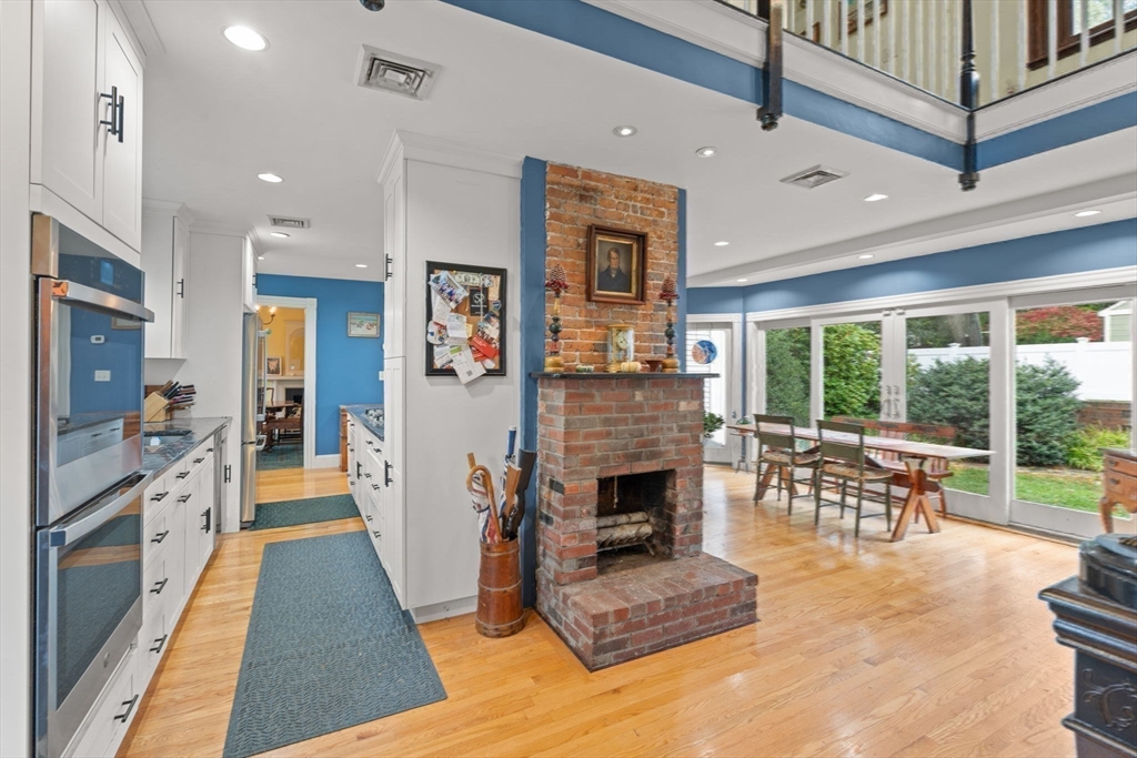 600 East Street Dedham, MA 02026 - Photo 9 of 39 a living room with furniture and a fireplace