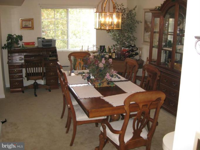 4950 Columbia Road, Unit 3 21 Columbia, MD 21044 - Photo 6 of 9 a view of a dining room with furniture window and outside view