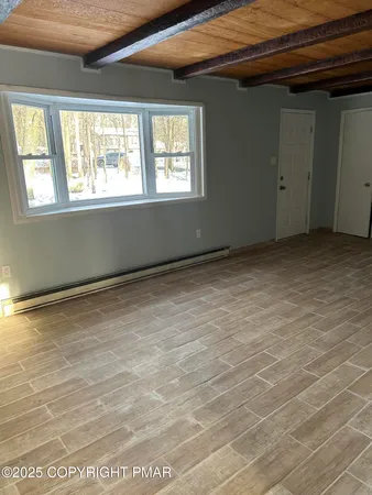 a kitchen with stainless steel appliances kitchen island granite countertop a refrigerator and a sink