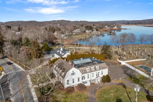 a view of a house with backyard and deck