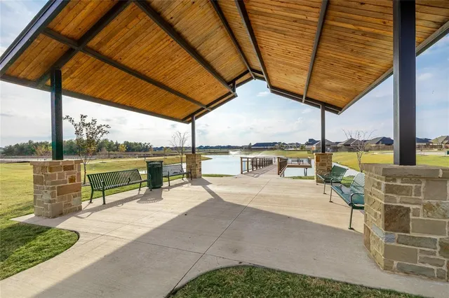 a view of a swimming pool with a patio