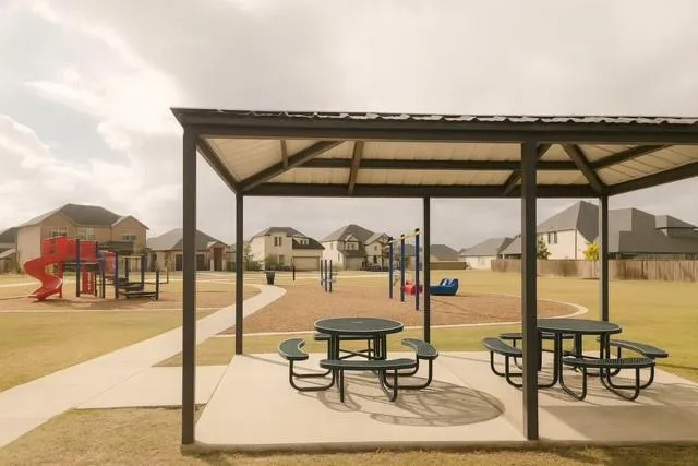 a building outdoor space with patio area and glass door