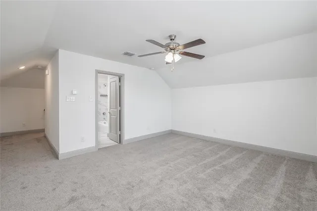 an empty room with a empty space and a ceiling fan