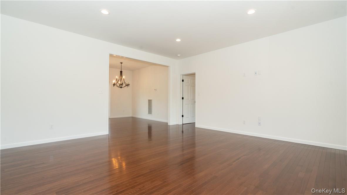475 Du Bois Road Wallkill, NY 12589 - Photo 12 of 35 a view of an empty room with wooden floor
