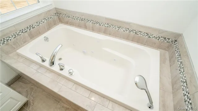 a view of white cabinet and mirror