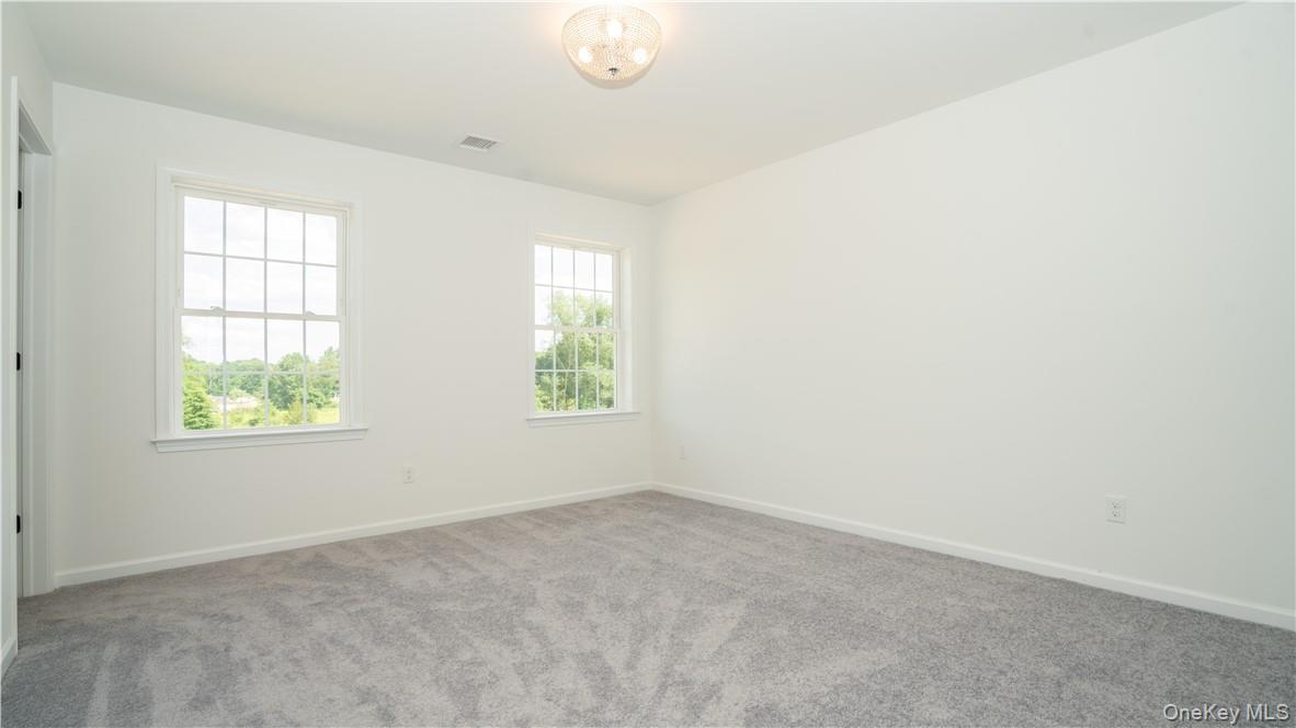 475 Du Bois Road Wallkill, NY 12589 - Photo 22 of 35 an empty room with windows