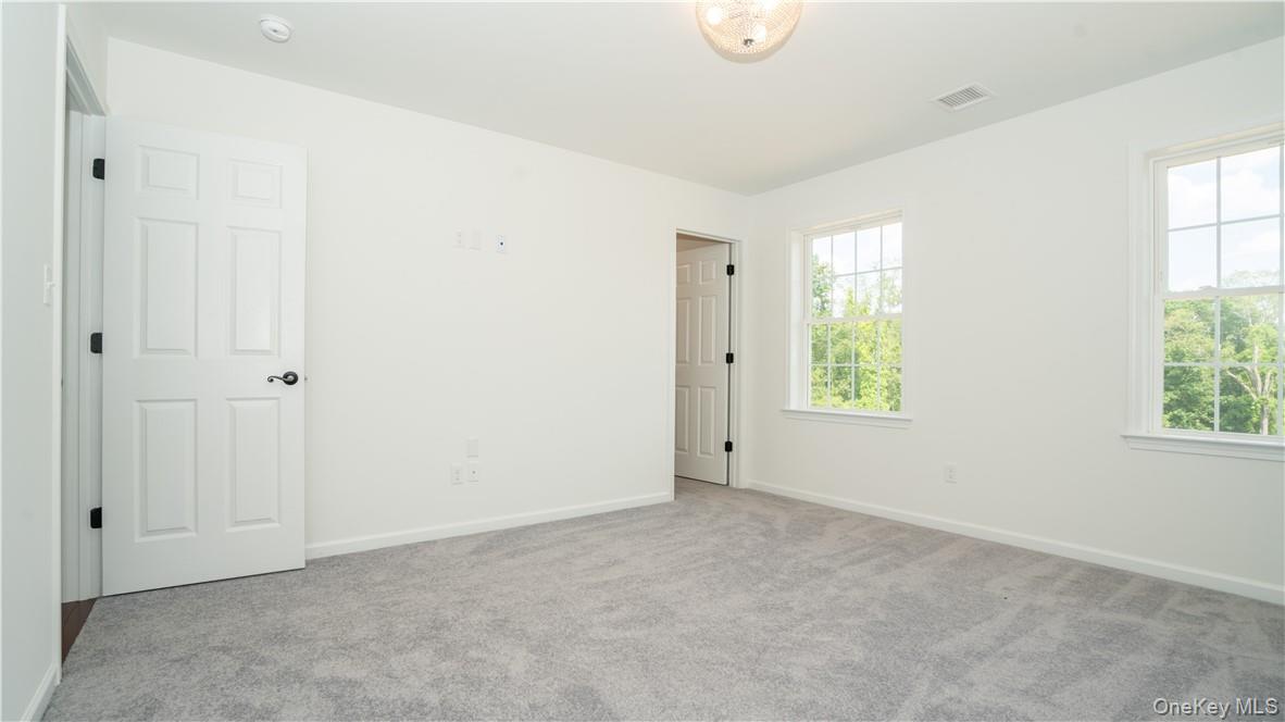 475 Du Bois Road Wallkill, NY 12589 - Photo 23 of 35 an empty room with windows