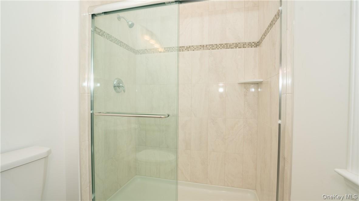 475 Du Bois Road Wallkill, NY 12589 - Photo 29 of 35 a bathroom with a glass shower door