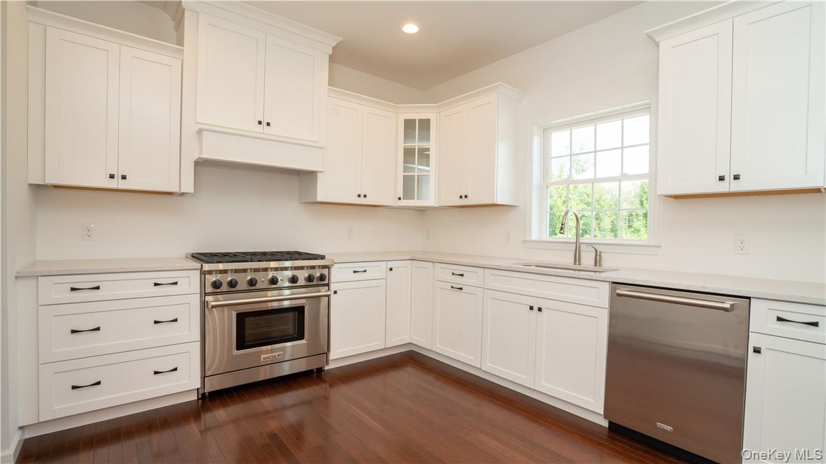 475 Du Bois Road Wallkill, NY 12589 - Photo 5 of 35 a kitchen with cabinets appliances and a window